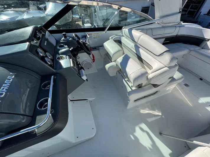  Yacht Photos Pics 2014 Formula 350 Crossover Bowrider cockpit with helm and seating area.