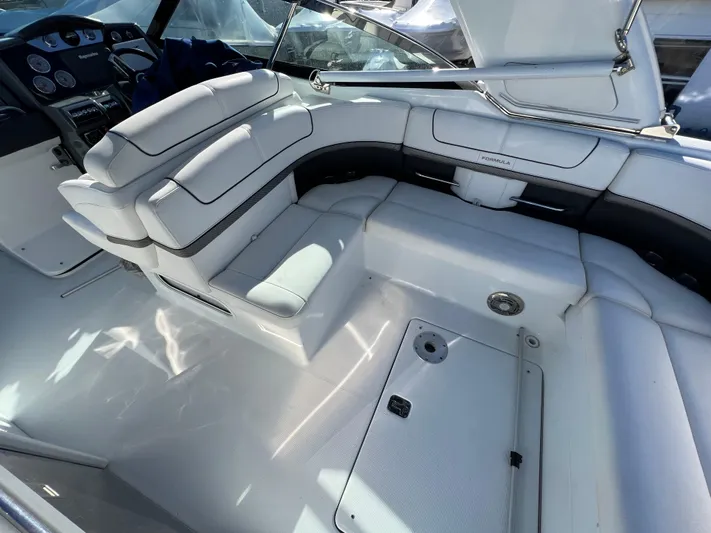  Yacht Photos Pics 2014 Formula 350 Crossover Bowrider interior with white leather seating and dashboard.