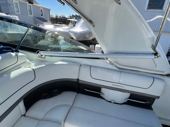  Yacht Photos Pics 2014 Formula 350 Crossover Bowrider interior seating area with white upholstery.