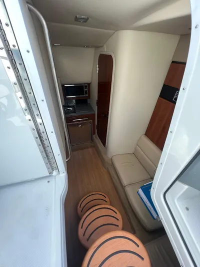  Yacht Photos Pics 2014 Formula 350 Crossover Bowrider interior cabin with seating and kitchenette.