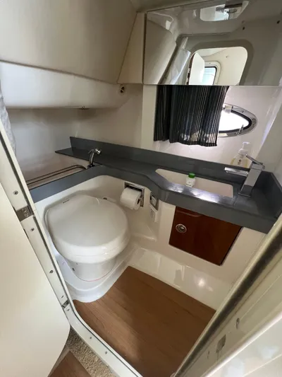  Yacht Photos Pics 2014 Formula 350 Crossover Bowrider bathroom with modern fixtures and wooden flooring.