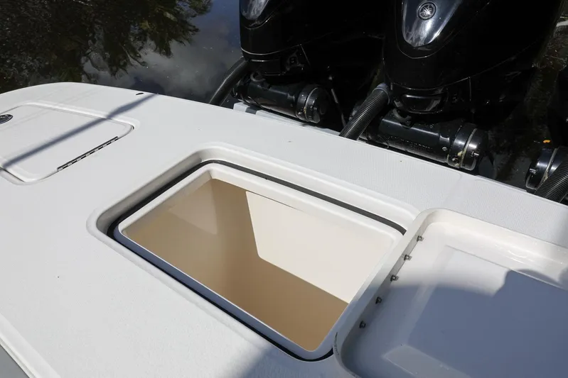 Grey Hull Yacht Photos Pics 2020 Regulator 41 boat with open storage compartment and dual outboard engines.