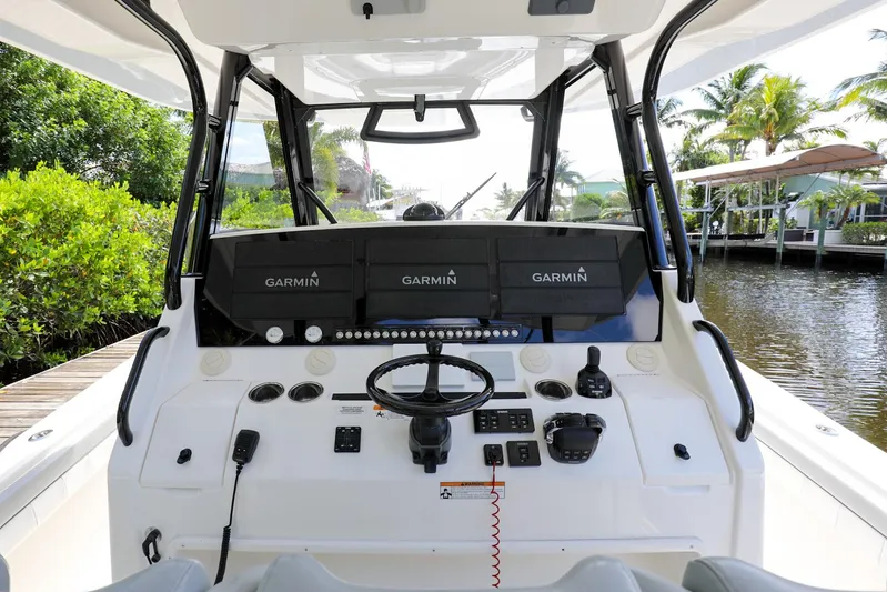 Grey Hull Yacht Photos Pics 2020 Regulator 41 boat helm with Garmin navigation systems.