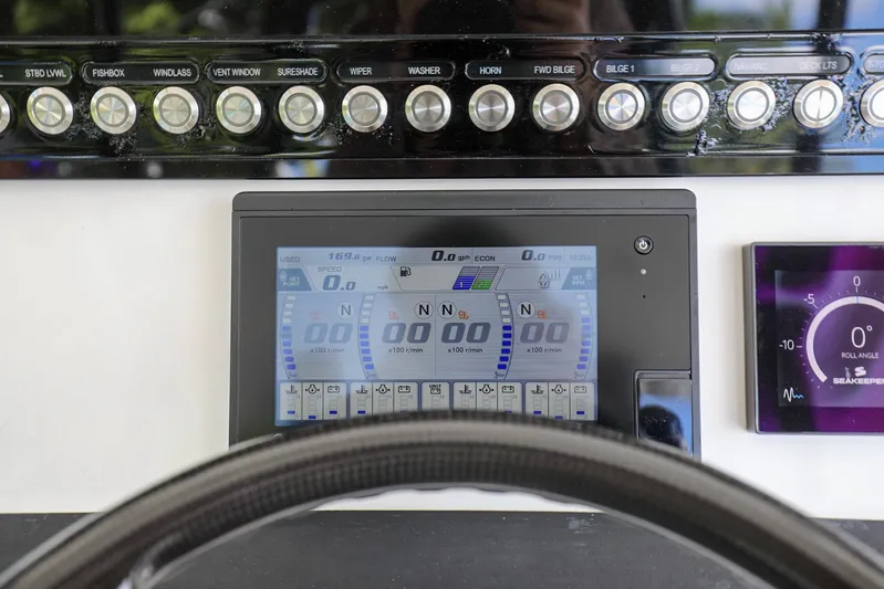 Grey Hull Yacht Photos Pics Control panel of a 2020 Regulator 41 boat with digital display and buttons.