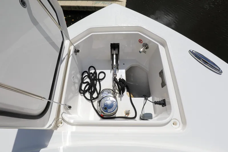 Grey Hull Yacht Photos Pics Open storage compartment on a 2020 Regulator 41 boat with anchor and ropes.