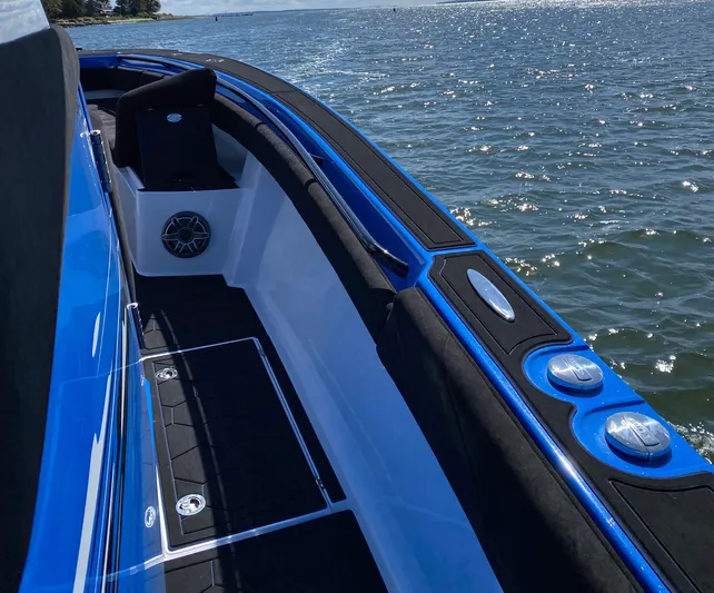  Yacht Photos Pics 2021 Statement 380 Open boat on water, featuring sleek blue and black design.