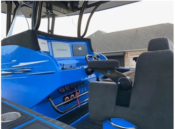  Yacht Photos Pics 2021 Statement 380 Open boat cockpit with Garmin navigation system.