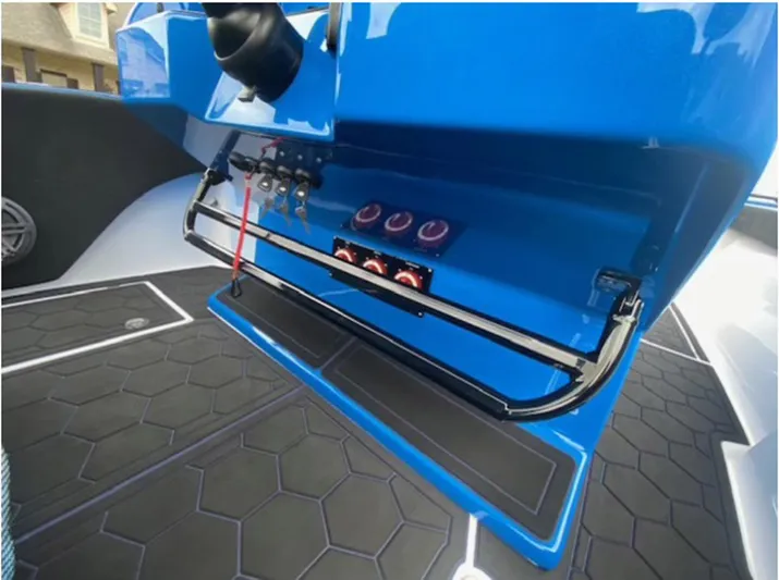  Yacht Photos Pics 2021 Statement 380 Open boat dashboard with blue panel and control switches.