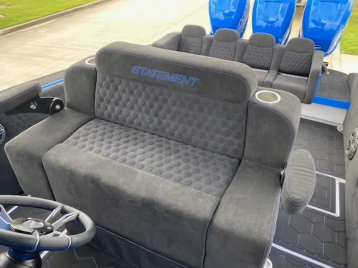  Yacht Photos Pics Luxurious seating on 2021 Statement 380 Open boat with plush upholstery and cup holders.