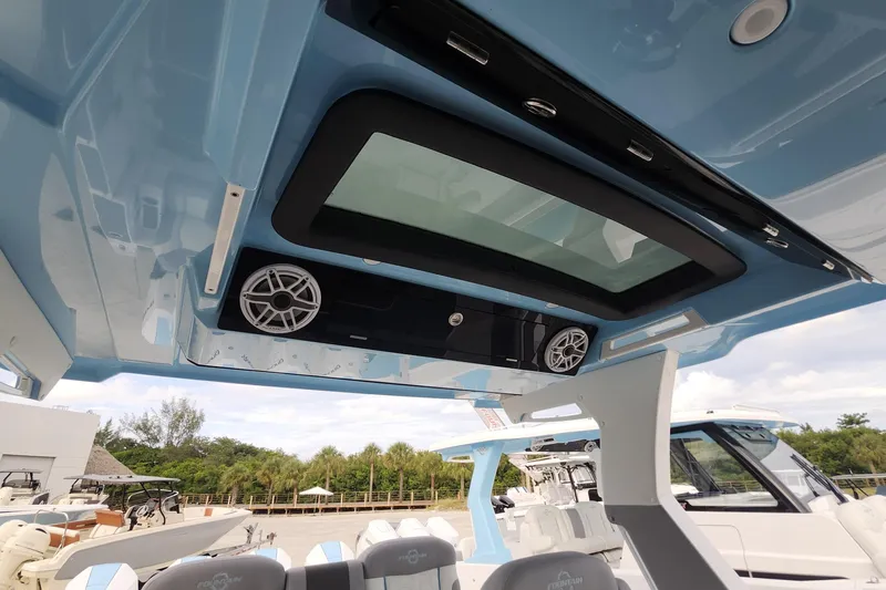  Yacht Photos Pics 2025 Fountain 38 SCX boat interior with skylight and speakers, showcasing modern design features.