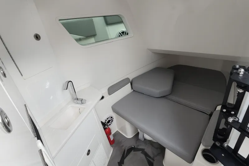  Yacht Photos Pics 2025 Fountain 38 SCX cabin interior with sink, seating, and window.