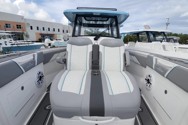  Yacht Photos Pics 2025 Fountain 38 SCX boat interior with modern seating and sleek design.