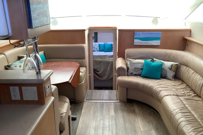 Sea Fox Yacht Photos Pics Luxurious interior of 1997 Carver 500 Cockpit Motor Yacht with plush seating and elegant decor.