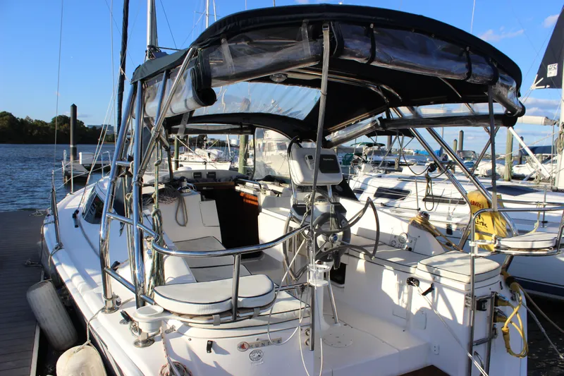  Yacht Photos Pics 2014 Hunter 33 sailboat docked, featuring a spacious cockpit and modern navigation equipment.