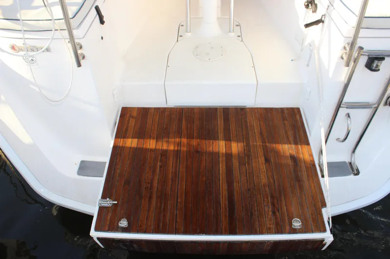  Yacht Photos Pics Hunter 33 sailboat stern with teak swim platform, 2014 model.