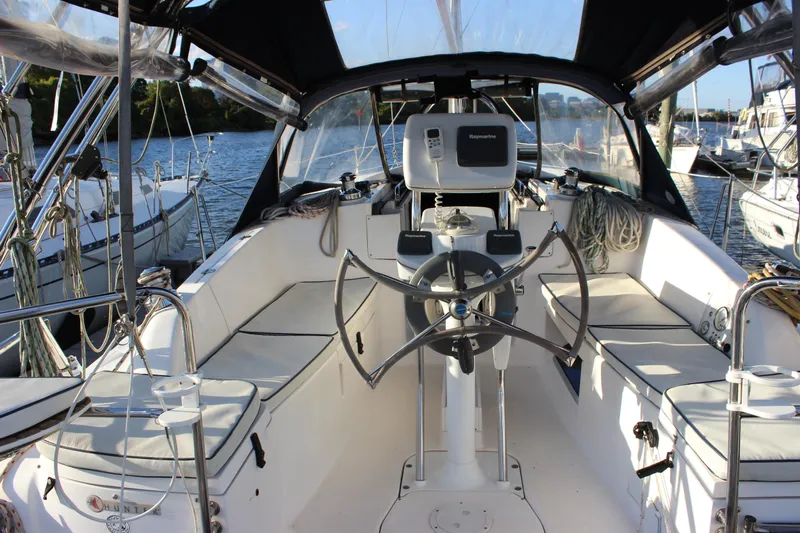  Yacht Photos Pics Cockpit of 2014 Hunter 33 sailboat with steering wheel and navigation equipment.