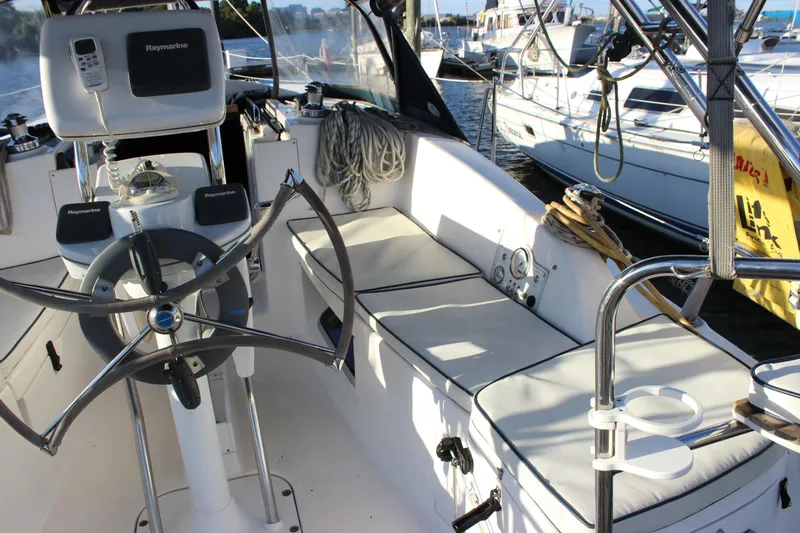 Yacht Photos Pics Cockpit of 2014 Hunter 33 sailboat with steering wheel and navigation equipment.
