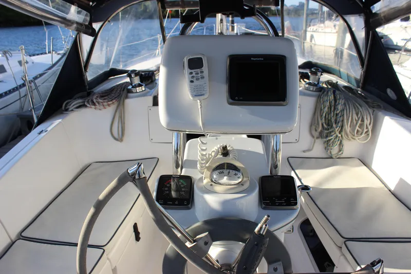  Yacht Photos Pics Cockpit of 2014 Hunter 33 sailboat with navigation equipment and seating.