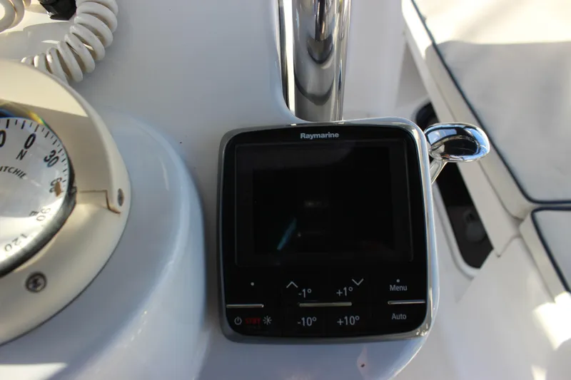  Yacht Photos Pics Raymarine navigation system on 2014 Hunter 33 sailboat, featuring compass and control panel.
