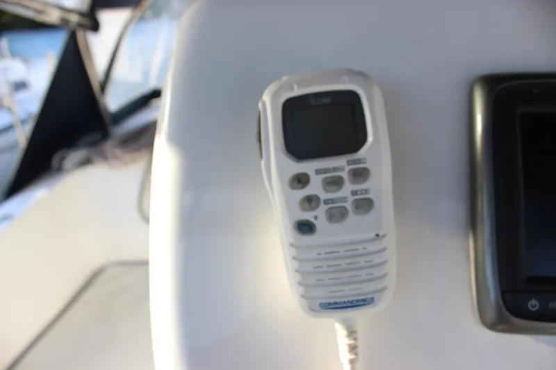  Yacht Photos Pics VHF radio on 2014 Hunter 33 sailboat dashboard, close-up view.