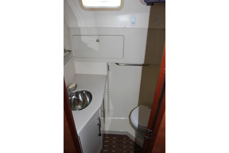  Yacht Photos Pics Compact bathroom in 2014 Hunter 33 sailboat with sink and toilet.