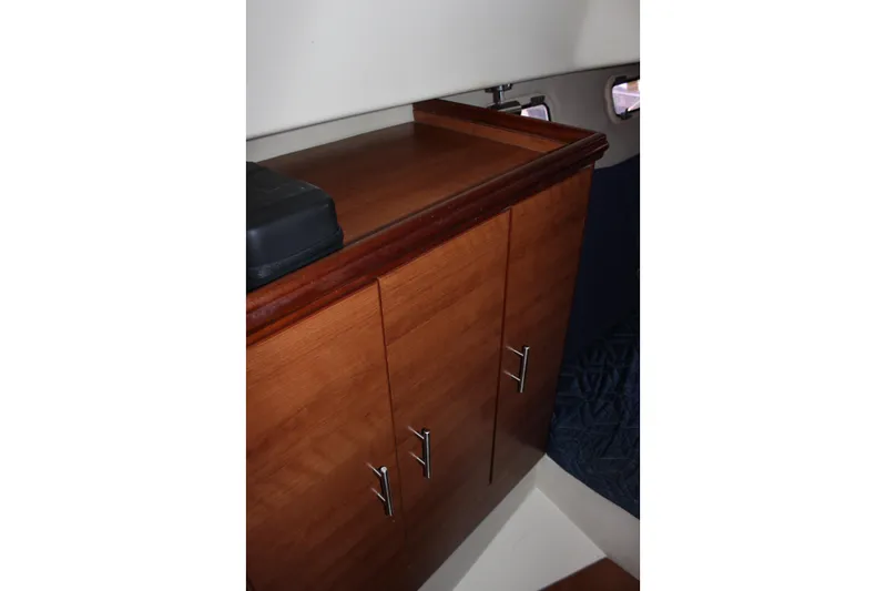 Yacht Photos Pics Wooden cabinet inside 2014 Hunter 33 boat cabin with sleek handles.