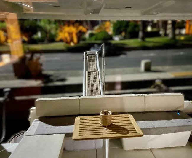  Yacht Photos Pics 2016 Cranchi Eco Trawler 53 Long Distance yacht interior with seating and table, dockside view.