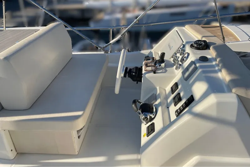  Yacht Photos Pics Cockpit of 2016 Cranchi Eco Trawler 53 Long Distance with steering wheel and controls.