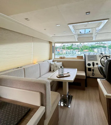  Yacht Photos Pics Luxurious interior of 2016 Cranchi Eco Trawler 53 Long Distance yacht with modern seating and helm.