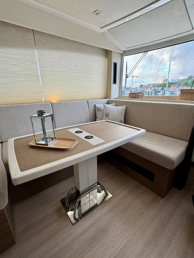  Yacht Photos Pics 2016 Cranchi Eco Trawler 53 Long Distance interior with cozy dining area and scenic window view.