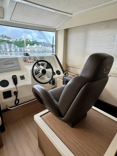  Yacht Photos Pics Helm of 2016 Cranchi Eco Trawler 53 Long Distance with leather captain's chair and navigation controls.