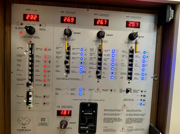  Yacht Photos Pics Control panel of 2016 Cranchi Eco Trawler 53 Long Distance, displaying voltage and switches.