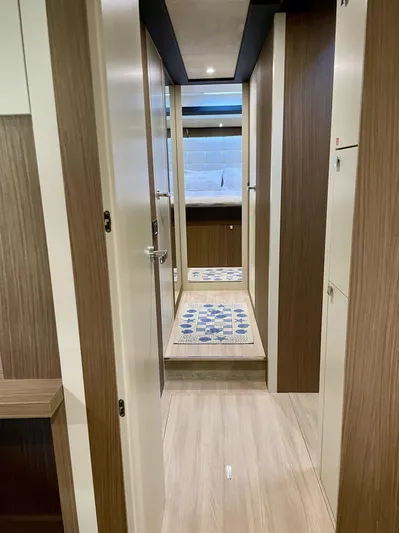  Yacht Photos Pics 2016 Cranchi Eco Trawler 53 Long Distance interior hallway with modern wood finish.