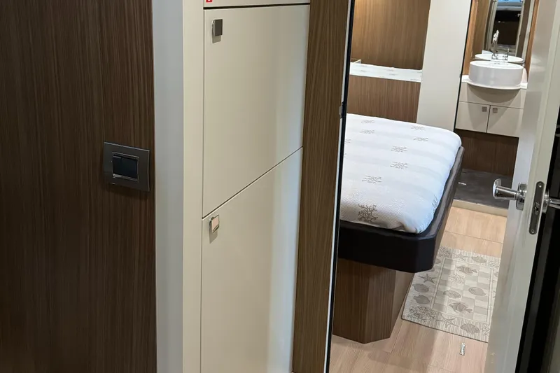  Yacht Photos Pics Interior of 2016 Cranchi Eco Trawler 53, featuring a cozy bedroom and modern bathroom.