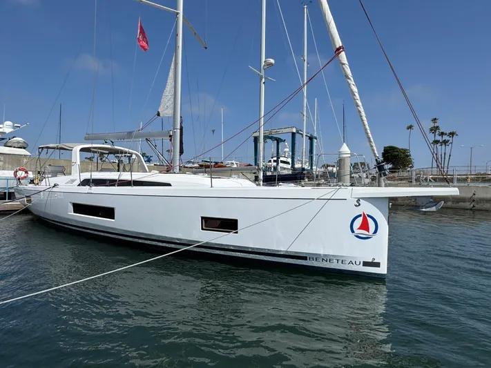 Sensei Yacht Photos Pics 2021 Beneteau Oceanis 46.1 sailboat docked in marina under clear blue sky.