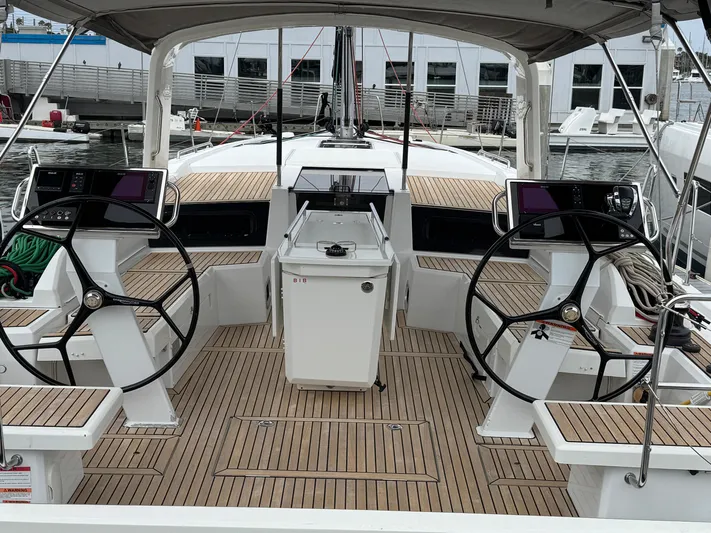 Sensei Yacht Photos Pics 2021 Beneteau Oceanis 46.1 yacht cockpit with dual steering wheels and teak decking.