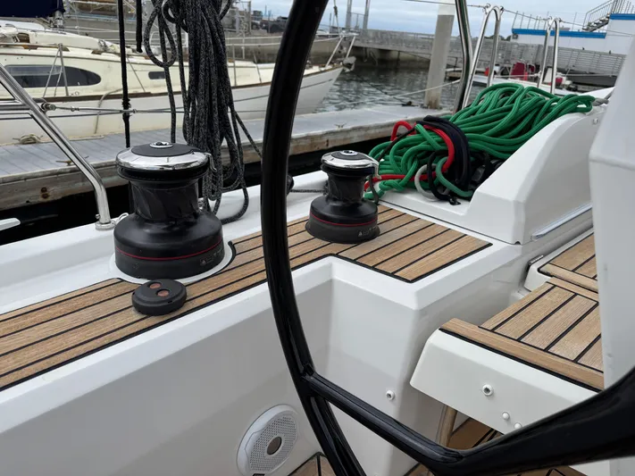 Sensei Yacht Photos Pics Deck view of 2021 Beneteau Oceanis 46.1 sailboat with winches and ropes.
