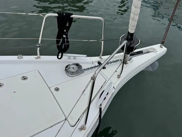 Sensei Yacht Photos Pics Bow of 2021 Beneteau Oceanis 46.1 sailboat with anchor and chain visible.