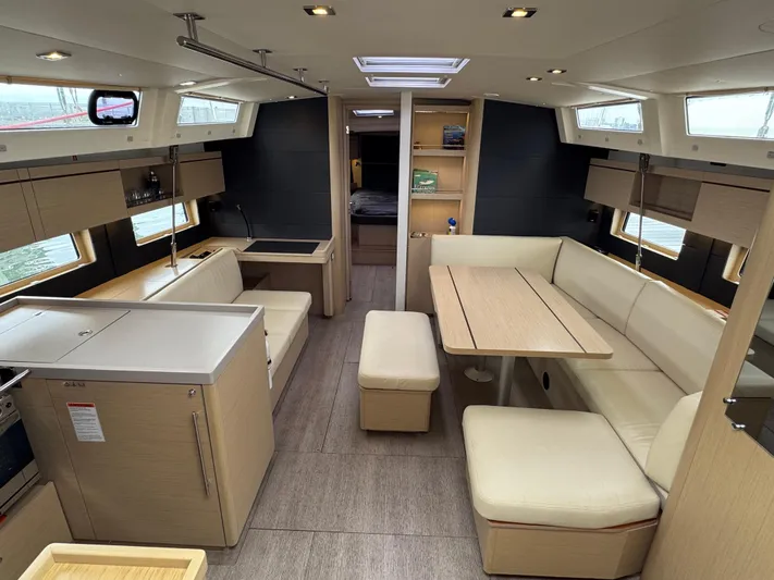 Sensei Yacht Photos Pics Interior of 2021 Beneteau Oceanis 46.1 yacht, featuring modern seating and dining area.