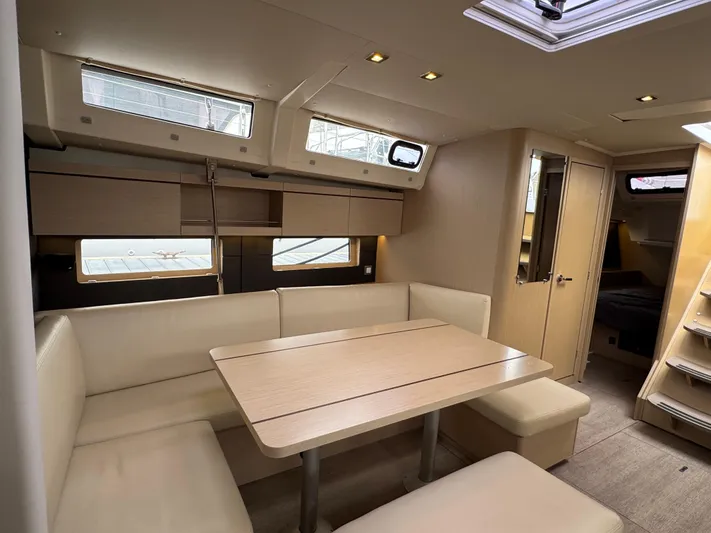 Sensei Yacht Photos Pics Interior of 2021 Beneteau Oceanis 46.1 yacht with modern seating and dining area.