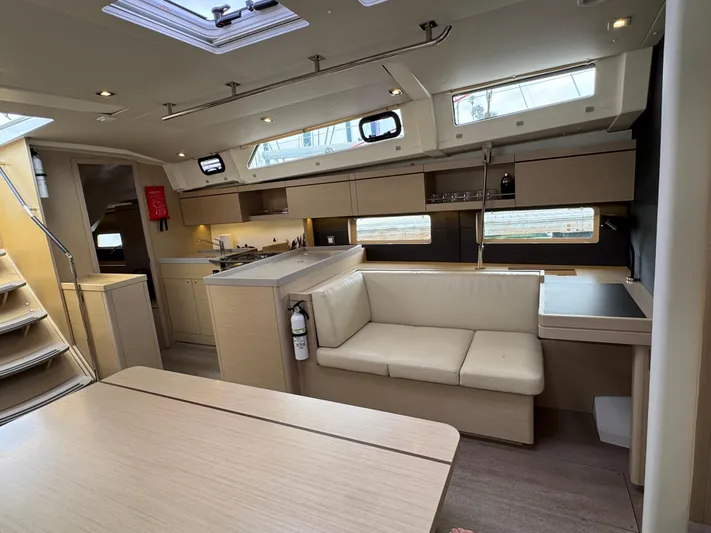Sensei Yacht Photos Pics Interior of 2021 Beneteau Oceanis 46.1 yacht, featuring modern kitchen and seating area.