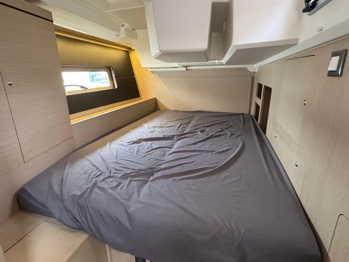 Sensei Yacht Photos Pics Interior cabin of 2021 Beneteau Oceanis 46.1 yacht with cozy bed and modern design.