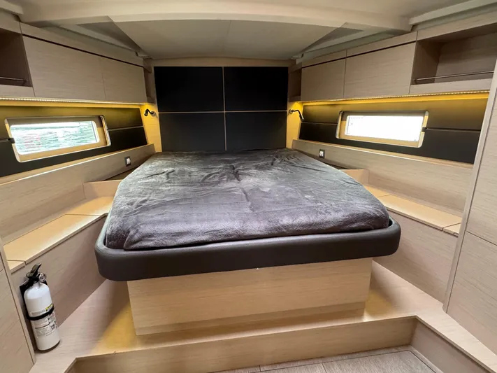 Sensei Yacht Photos Pics Luxurious cabin interior of 2021 Beneteau Oceanis 46.1 yacht with cozy bed and modern design.