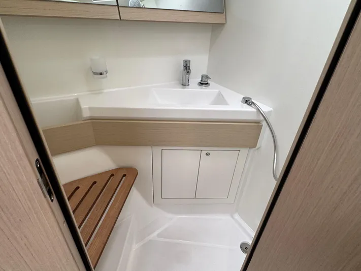 Sensei Yacht Photos Pics 2021 Beneteau Oceanis 46.1 bathroom with modern sink and wooden accents.