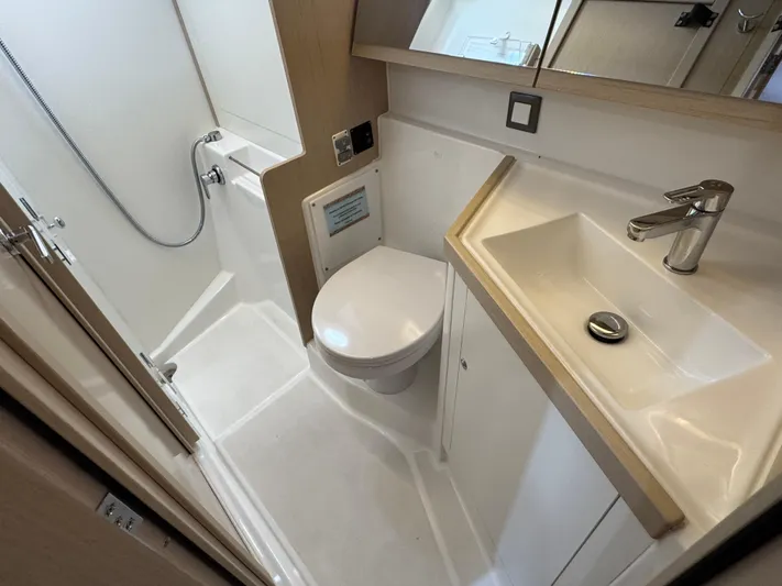 Sensei Yacht Photos Pics Bathroom of 2021 Beneteau Oceanis 46.1 yacht, featuring shower, toilet, and sink.