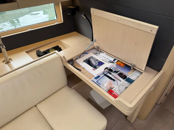 Sensei Yacht Photos Pics Interior of 2021 Beneteau Oceanis 46.1 yacht with storage compartment and navigation tools.