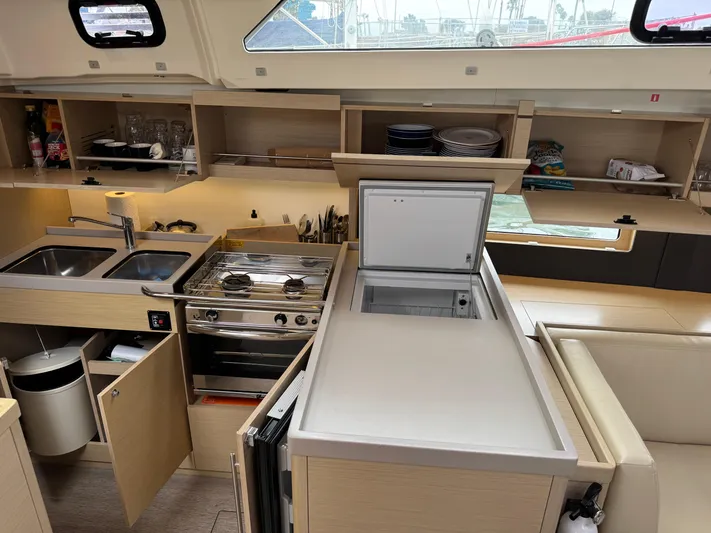 Sensei Yacht Photos Pics Modern kitchen interior of 2021 Beneteau Oceanis 46.1 yacht with appliances and storage.