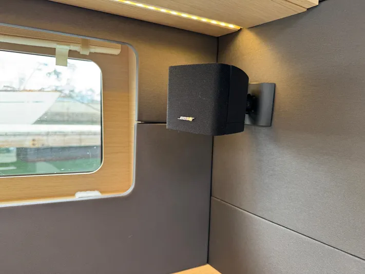 Sensei Yacht Photos Pics Bose speaker inside 2021 Beneteau Oceanis 46.1 yacht cabin, near window.