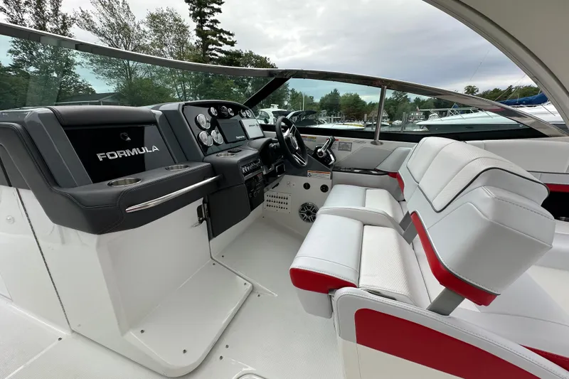  Yacht Photos Pics 2024 Formula 330 CBR boat interior with sleek dashboard and luxurious seating.