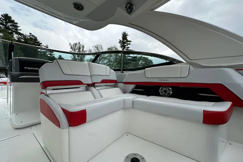  Yacht Photos Pics 2024 Formula 330 CBR boat interior with white and red seating, sleek design.